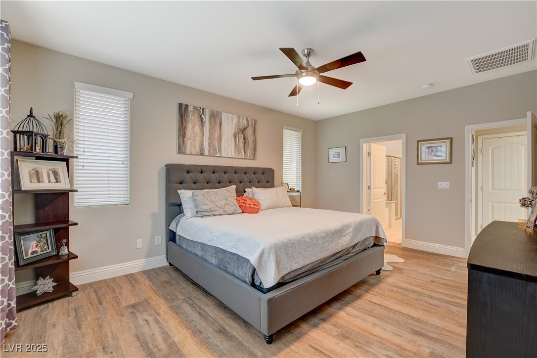 5741 Shadow Bend Drive Las Vegas, NV 89135 - Photo 30 of 78 Bedroom featuring baseboards, visible vents, ensui