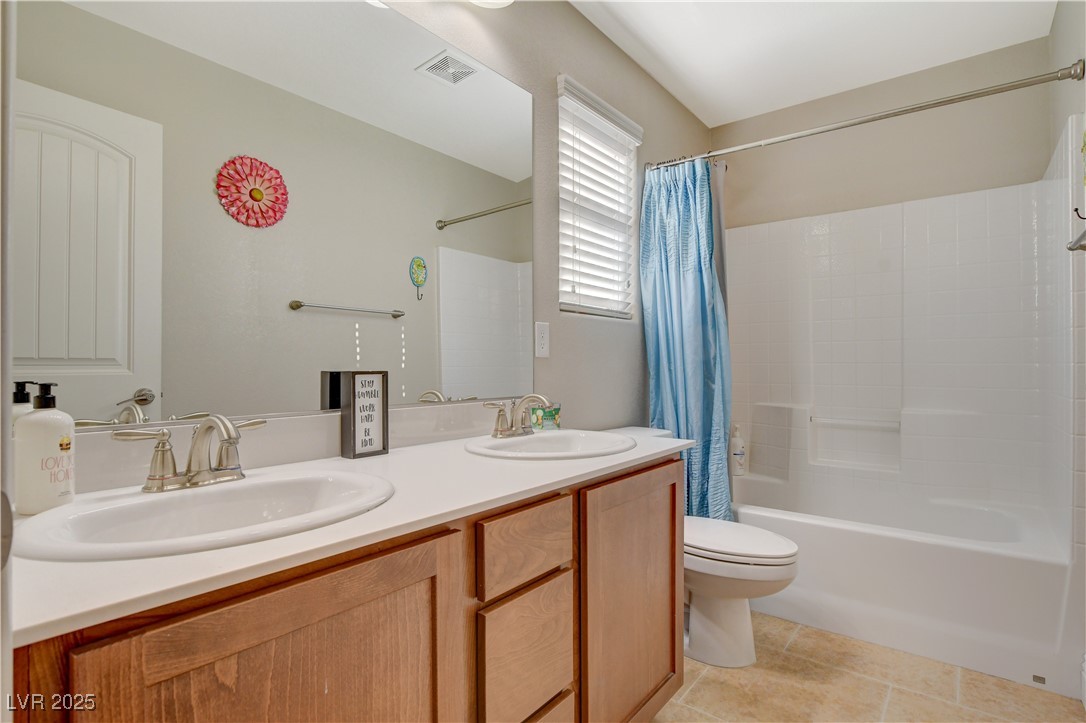 5741 Shadow Bend Drive Las Vegas, NV 89135 - Photo 48 of 78 Bathroom with toilet, visible vents, a sink, and t