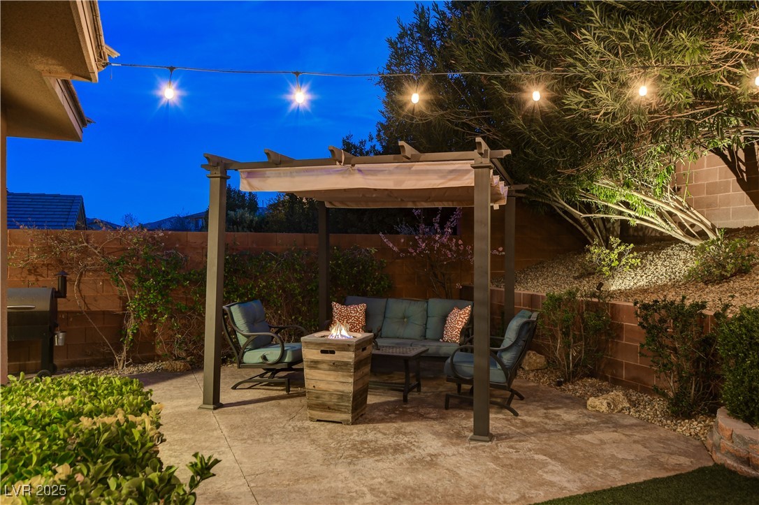 5741 Shadow Bend Drive Las Vegas, NV 89135 - Photo 51 of 78 Patio at twilight featuring a fenced backyard, an