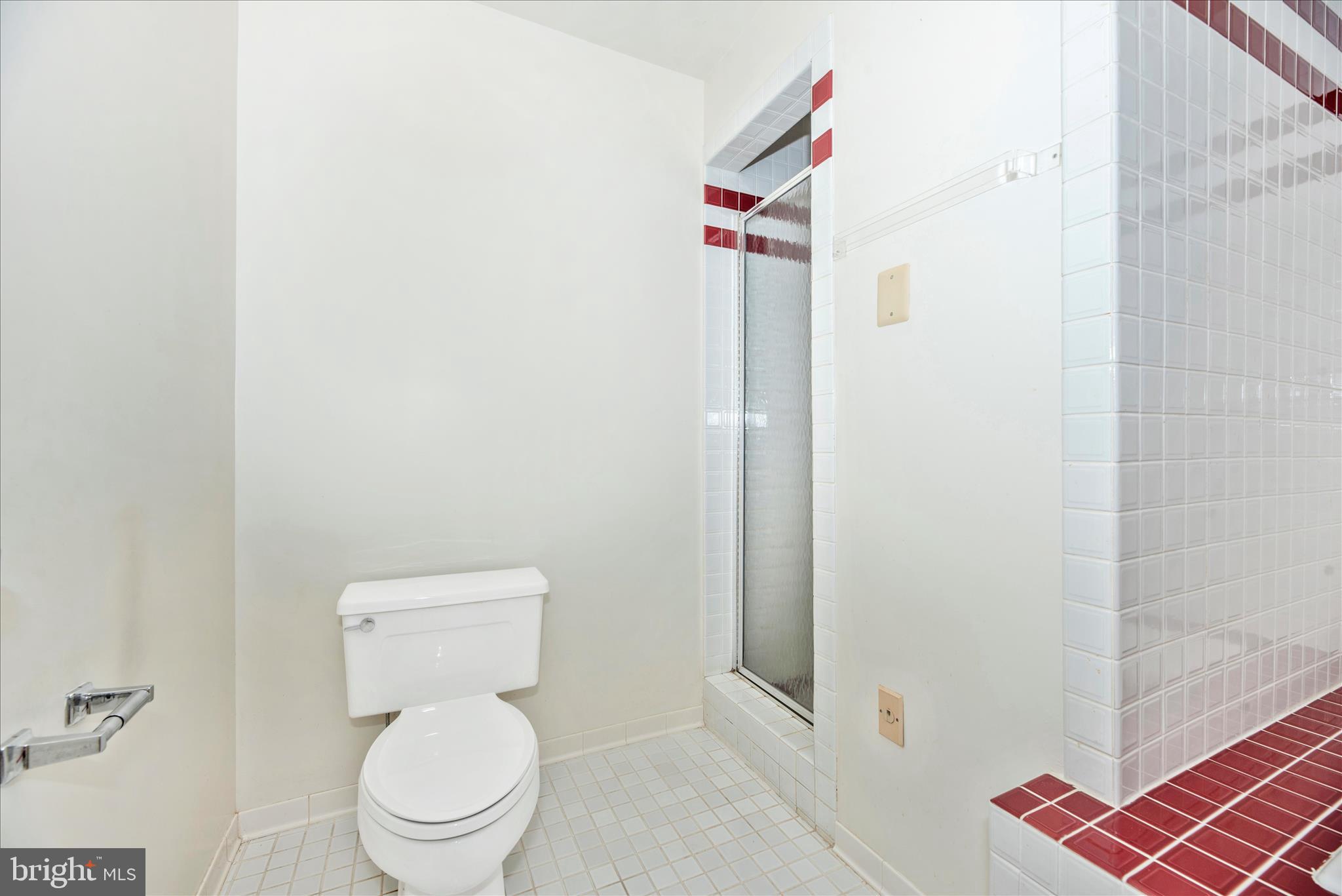 2221 Gold Mine Road Brookeville, MD 20833 - Photo 35 of 60 a white toilet sitting next to a shower