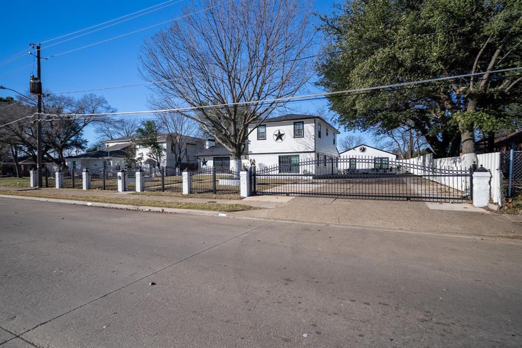 2133 Pleasant Drive Dallas, TX 75227 - Photo 4 of 40 View of front of home featuring a fenced front yard and a gate