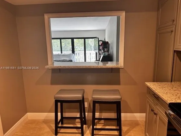 a kitchen with a sink and a window