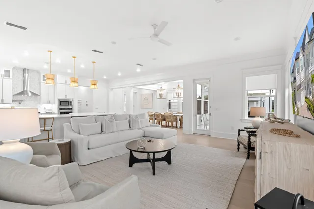 a living room with furniture and white walls
