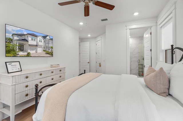 a bedroom with a bed and a dresser