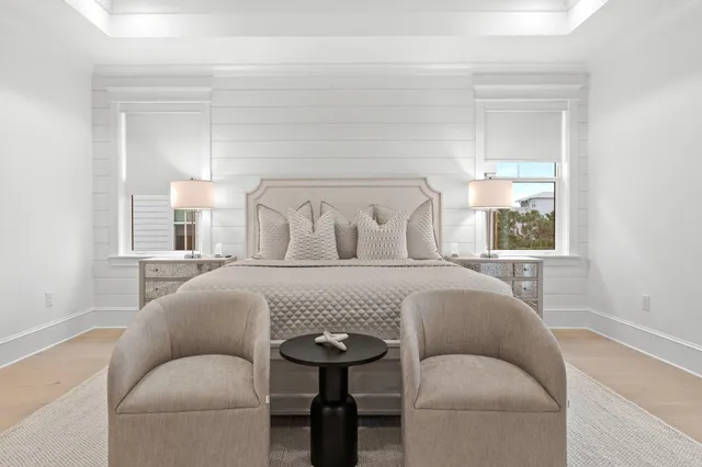 a bedroom with furniture and a window