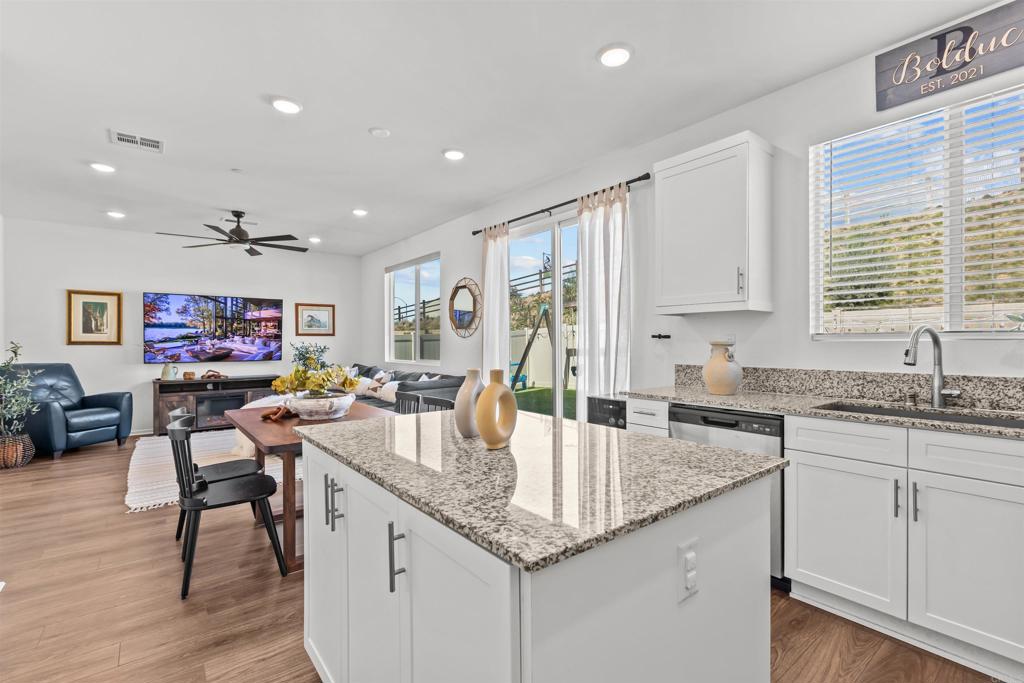 228 Hass Lane Fallbrook, CA 92028 - Photo 12 of 26 a kitchen with stainless steel appliances granite countertop a sink stove and cabinets