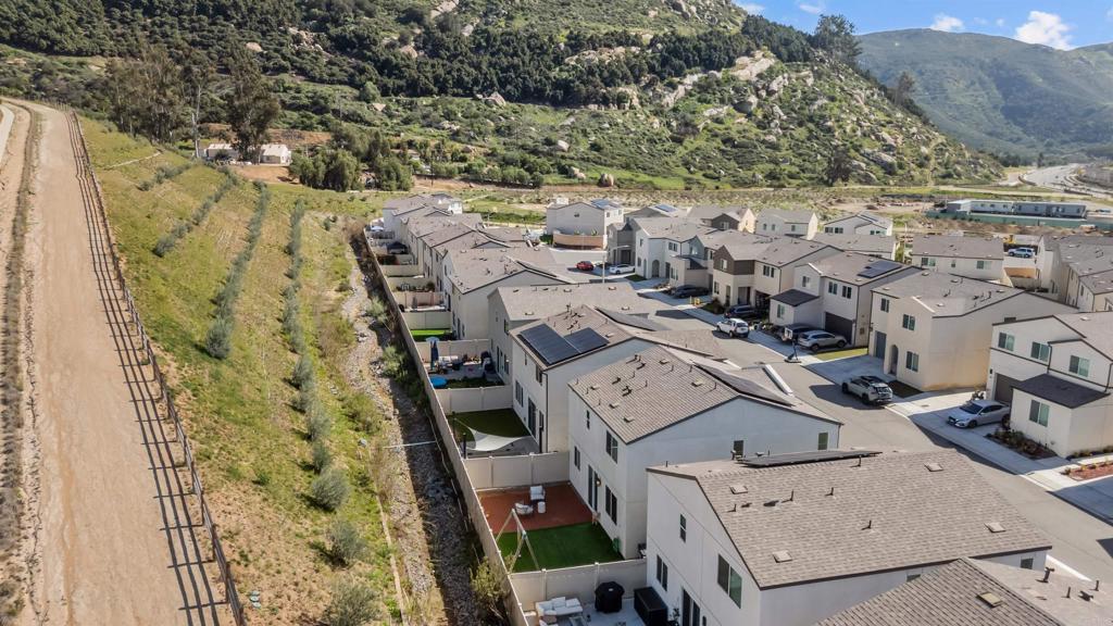 228 Hass Lane Fallbrook, CA 92028 - Photo 20 of 26 an aerial view of a residential apartment building with a yard