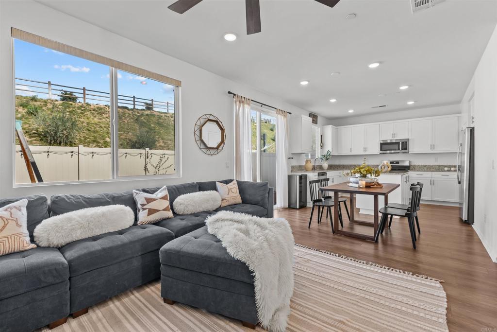 228 Hass Lane Fallbrook, CA 92028 - Photo 4 of 26 a living room with furniture and a large window