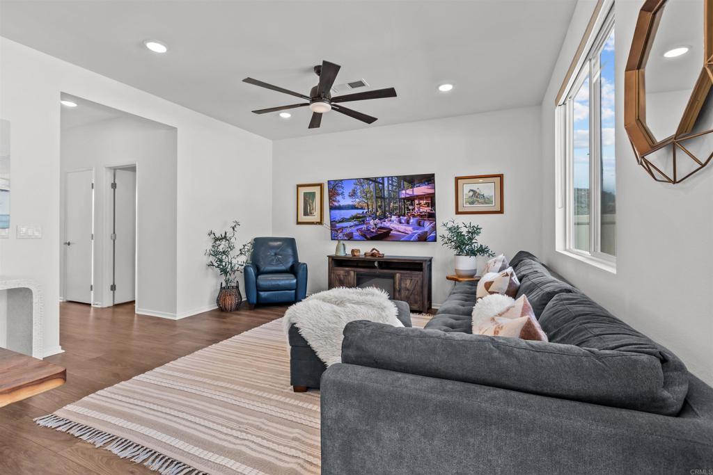 228 Hass Lane Fallbrook, CA 92028 - Photo 5 of 26 a living room with furniture and a flat screen tv