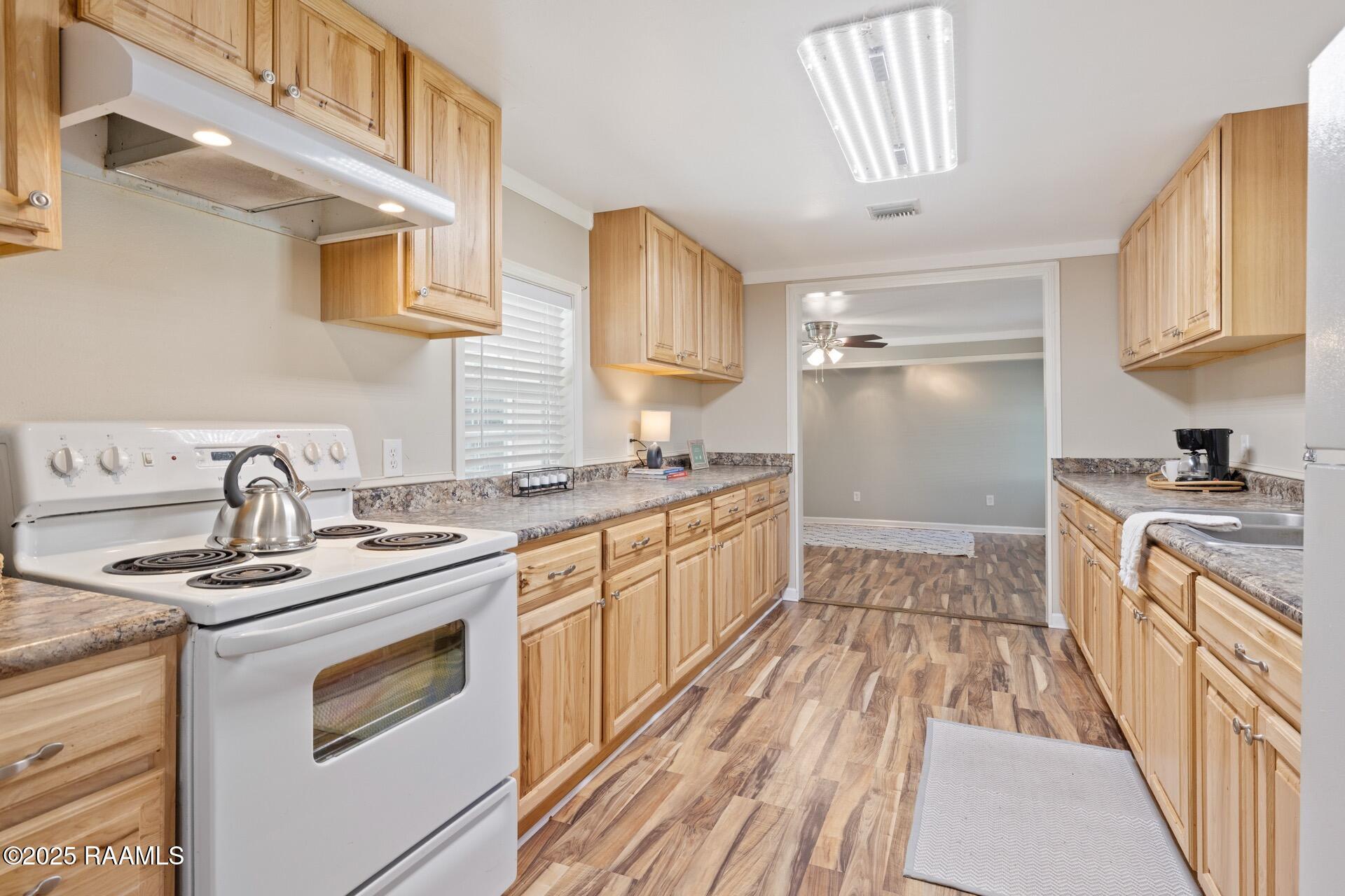 1002 Alexander Road St. Martinville, LA 70582 - Photo 6 of 17 kitchen lookingtowards living room