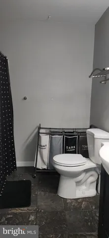 a view of a balcony with chair and wooden floor