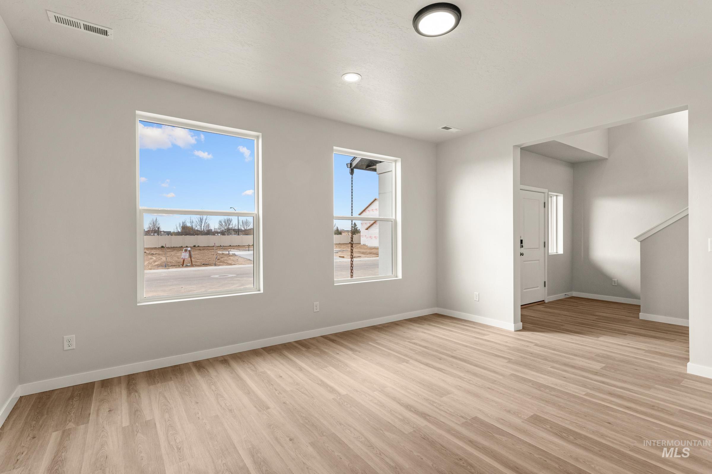 13688 Redway Court Caldwell, ID 83607 - Photo 7 of 26 Unfurnished room with baseboards and light wood finished floors
