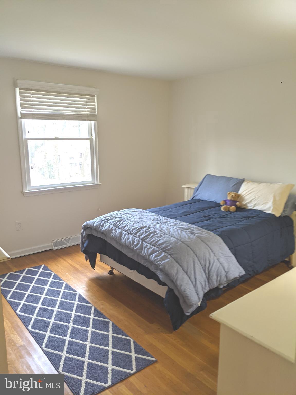 611 Andover Road Newtown Square, PA 19073 - Photo 18 of 27 a bedroom with a bed and a window