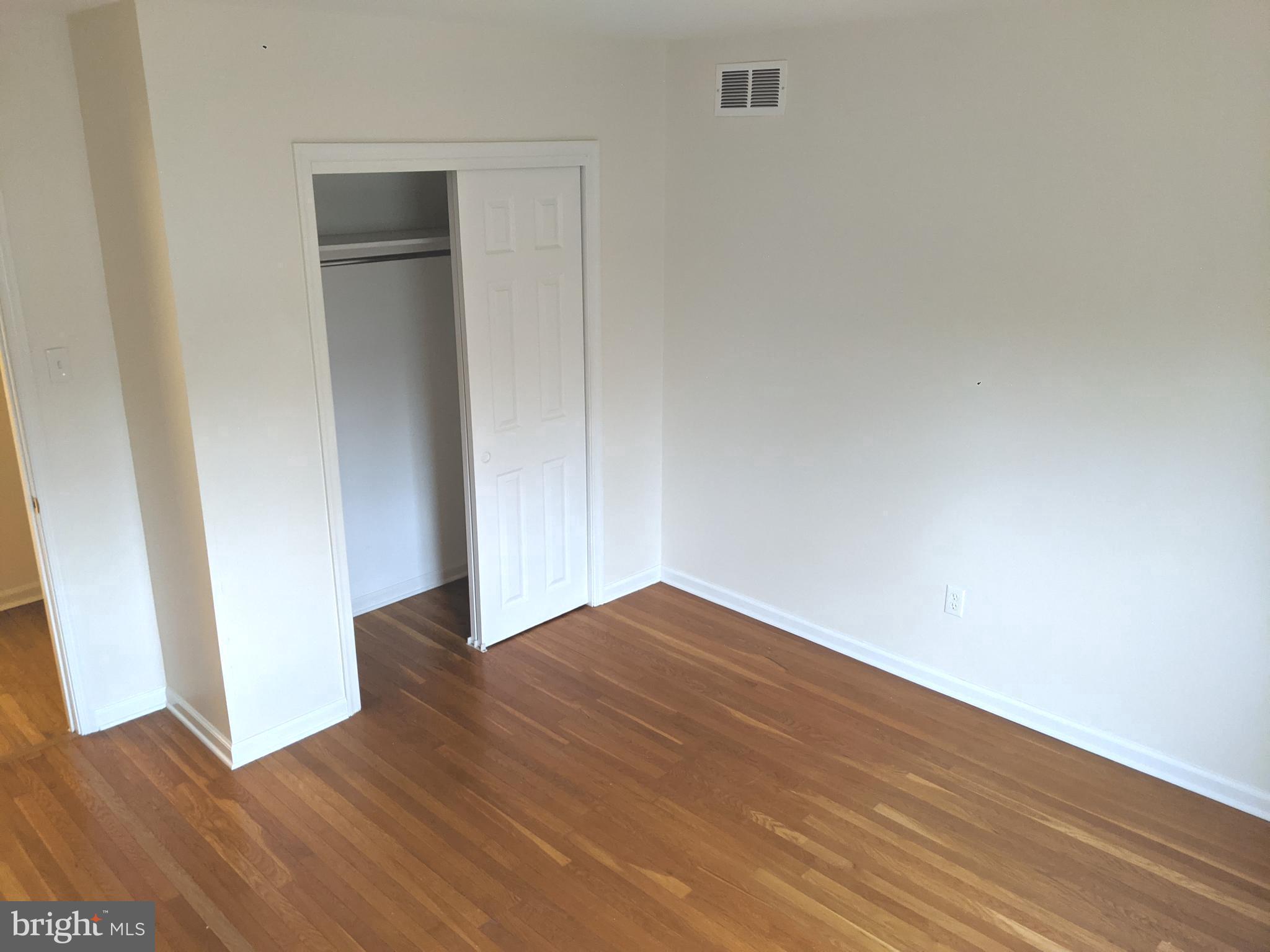 611 Andover Road Newtown Square, PA 19073 - Photo 20 of 27 a view of an empty room with wooden floor and closet