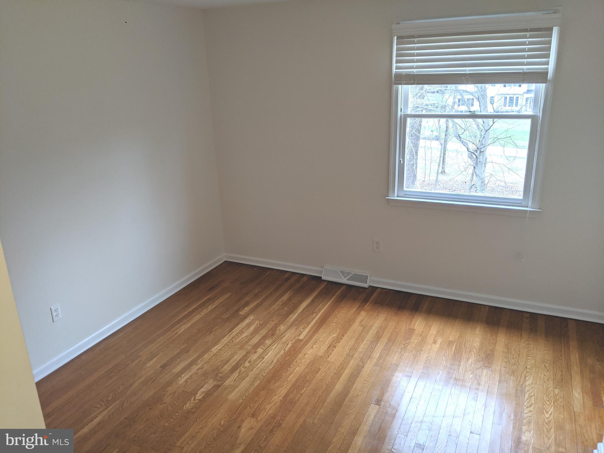 611 Andover Road Newtown Square, PA 19073 - Photo 21 of 27 wooden floor in an empty room with a window