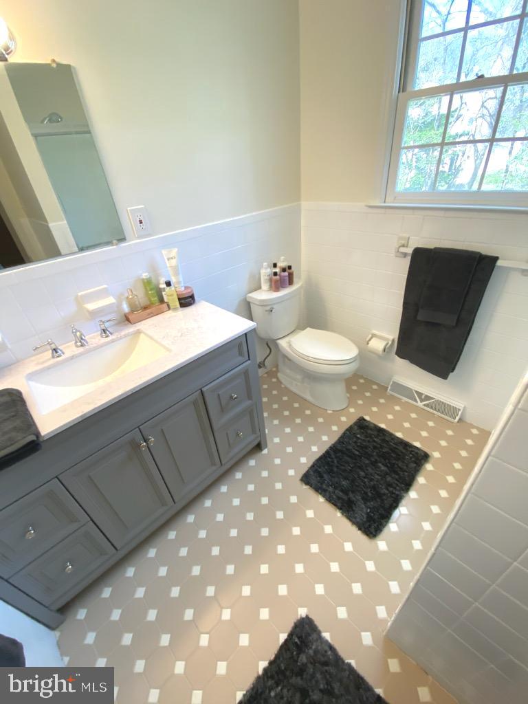 611 Andover Road Newtown Square, PA 19073 - Photo 22 of 27 a bathroom with a sink toilet and window