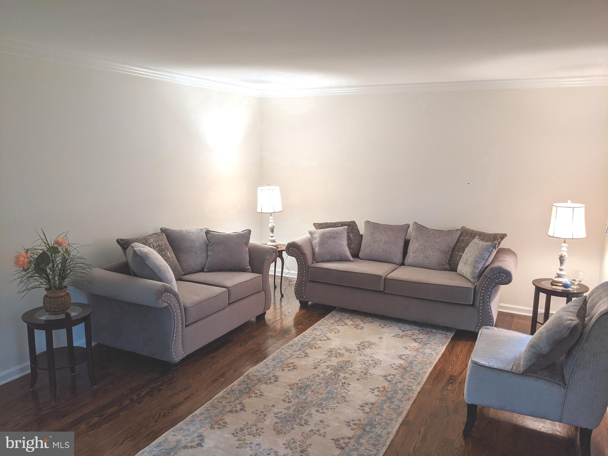 611 Andover Road Newtown Square, PA 19073 - Photo 4 of 27 a living room with furniture and a couch
