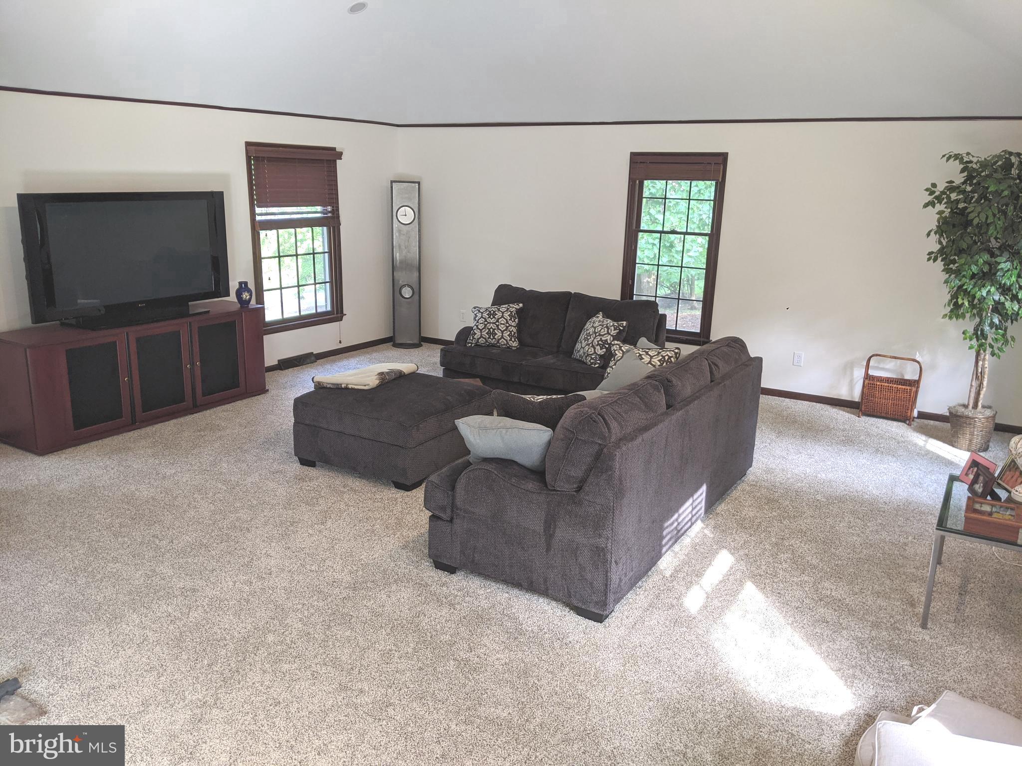 611 Andover Road Newtown Square, PA 19073 - Photo 7 of 27 a living room with furniture and a flat screen tv