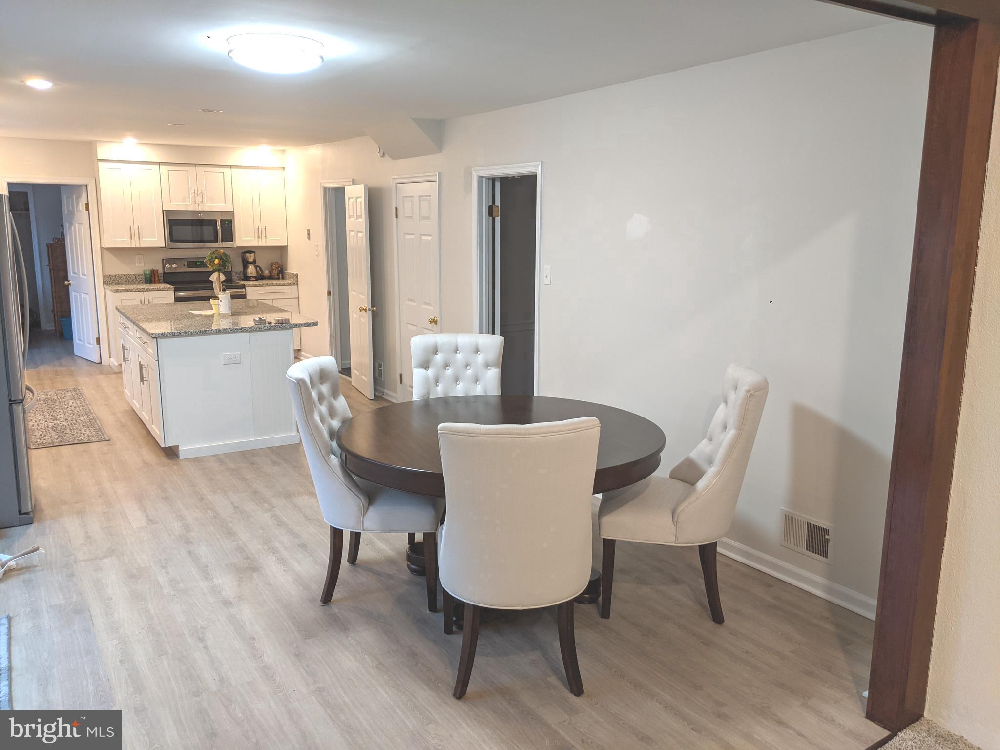 611 Andover Road Newtown Square, PA 19073 - Photo 8 of 27 a dining room with furniture and wooden floor