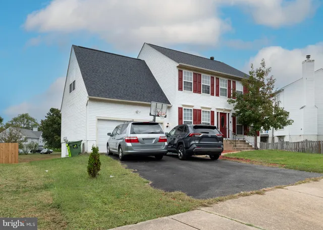 a car parked in front of a house