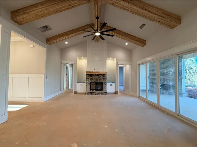 a kitchen with cabinets and wooden floor