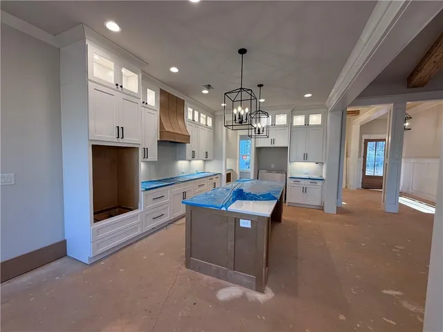 a view of an empty room with a fireplace