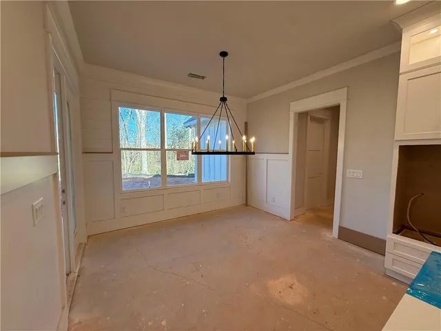 a view of an empty room with a closet