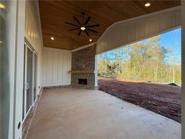a kitchen with granite countertop a sink and cabinets