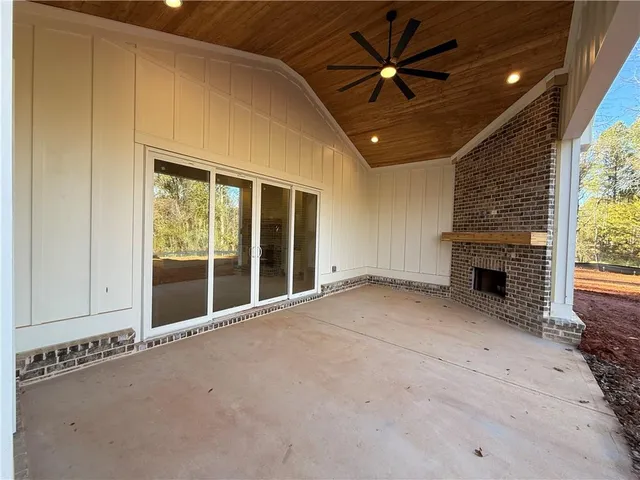 a bathroom with a granite countertop sink and mirror