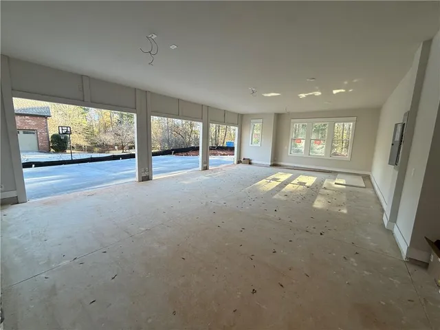 a view of a livingroom with a ceiling fan and window