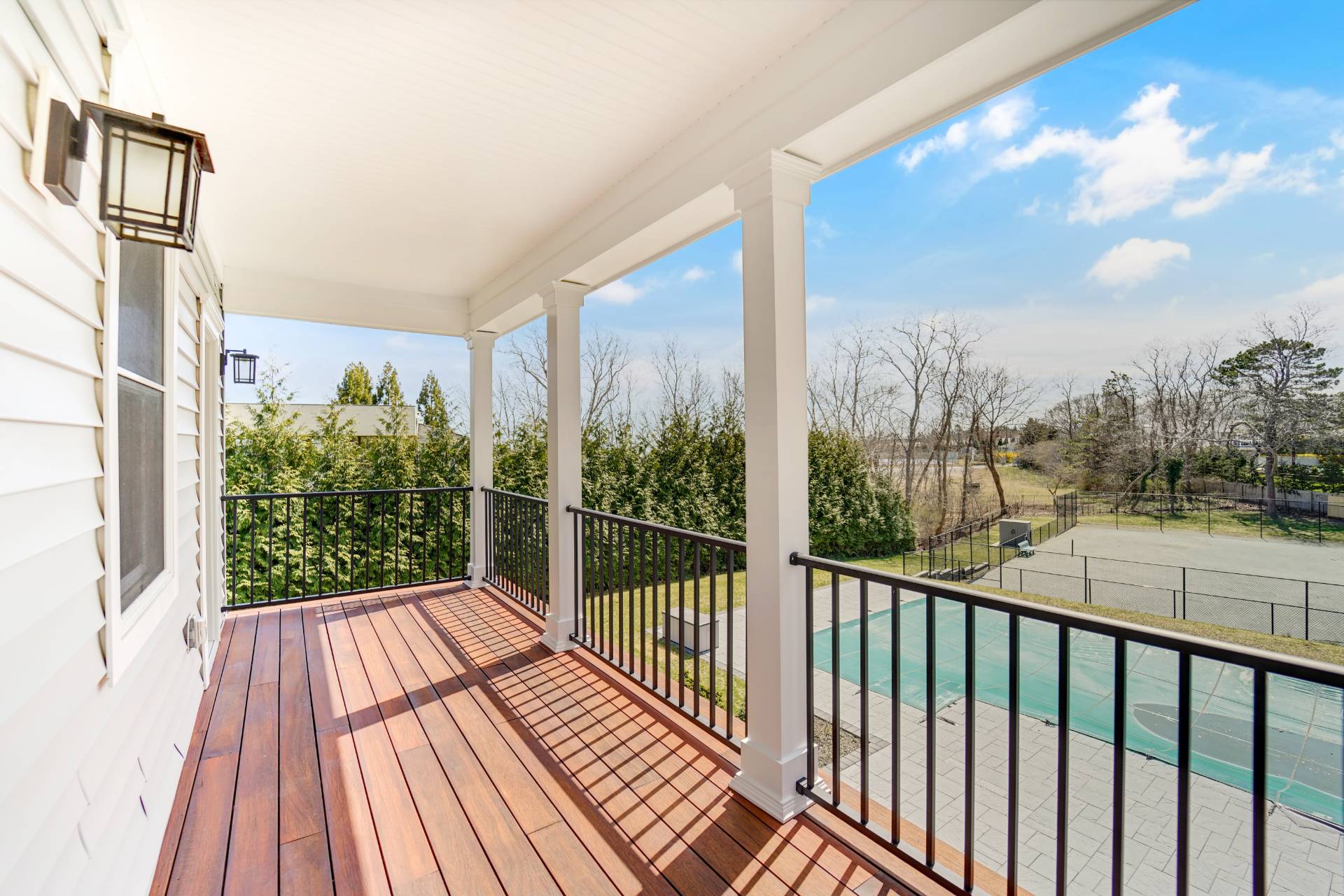 64 Romana Drive Hampton Bays, NY 11946 - Photo 23 of 29 a view of balcony with wooden floor