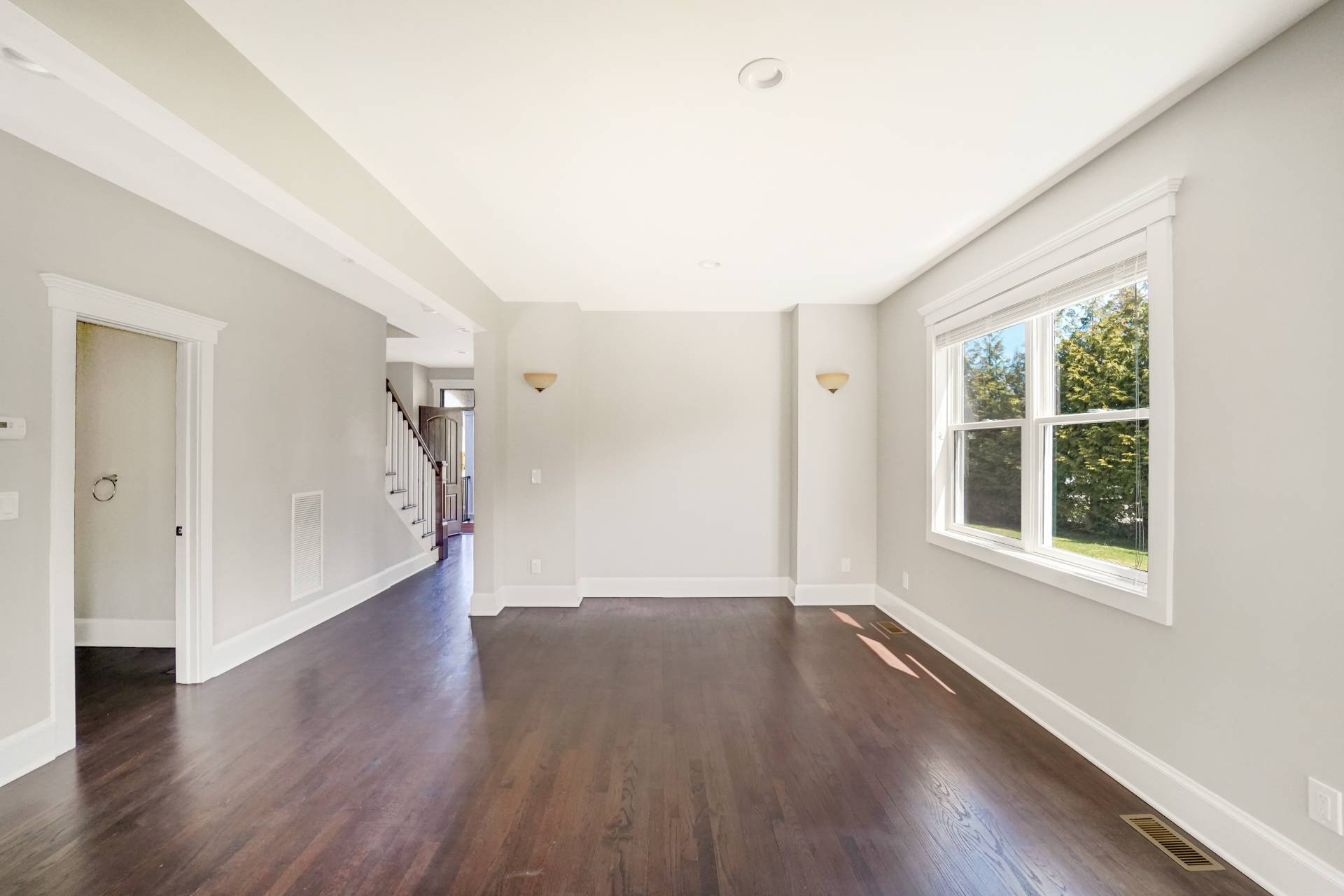 64 Romana Drive Hampton Bays, NY 11946 - Photo 10 of 29 wooden floor in an empty room with a window