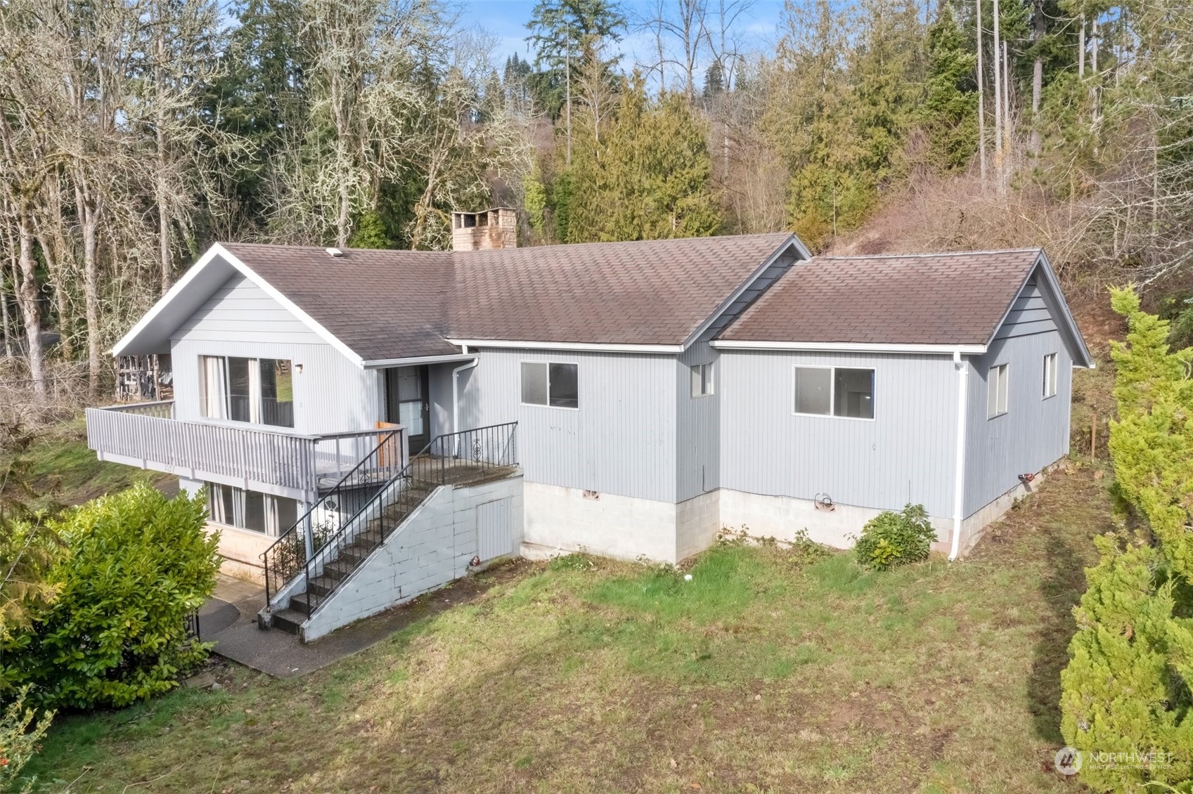 137 Wallace Road Chehalis, WA 98532 - Photo 1 of 39 a aerial view of a house with yard and trees in the background