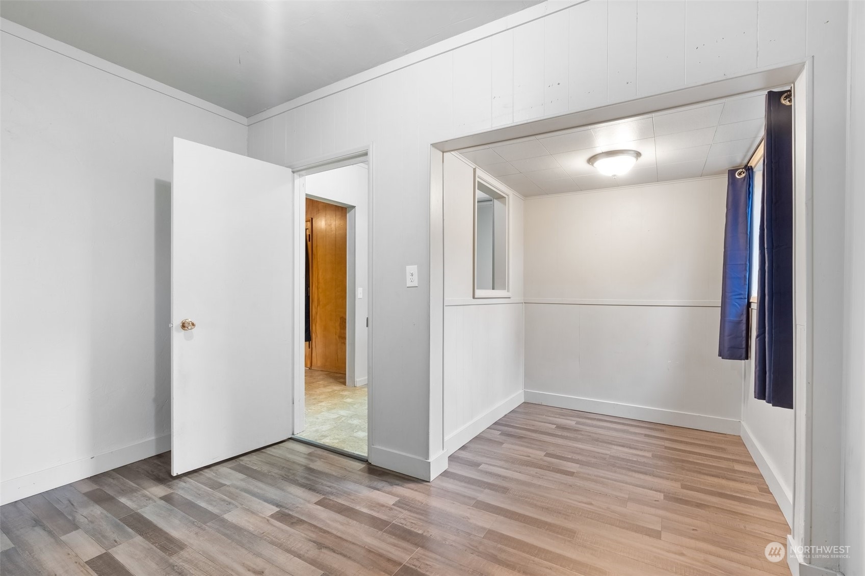 137 Wallace Road Chehalis, WA 98532 - Photo 16 of 39 a view of an empty room with wooden floor and a window