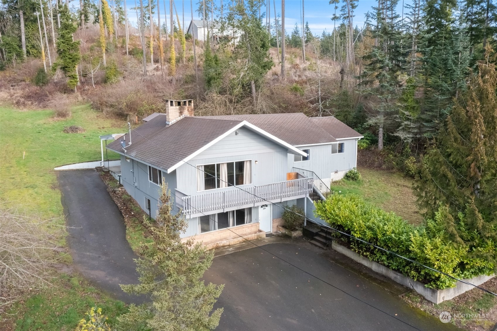 137 Wallace Road Chehalis, WA 98532 - Photo 2 of 39 a aerial view of a house with a yard and large trees