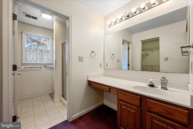 a view of a balcony with wooden floor and fence
