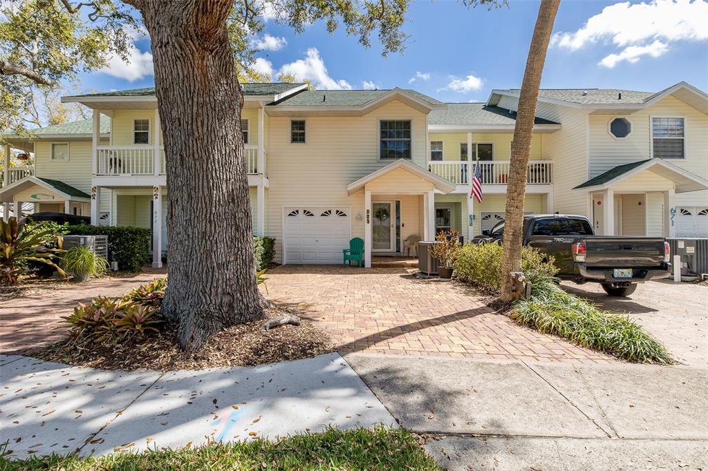 675 Broadway Dunedin, FL 34698 - Photo 1 of 1 a front view of a house with garden