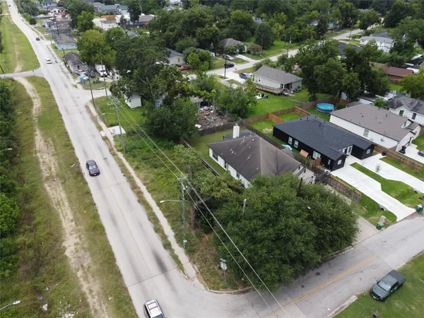 an aerial view of residential houses with outdoor space