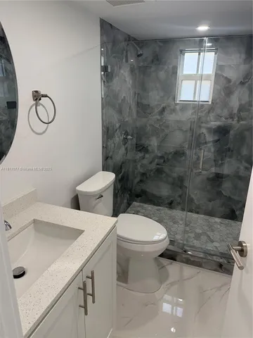 a bathroom with a sink and a toilet