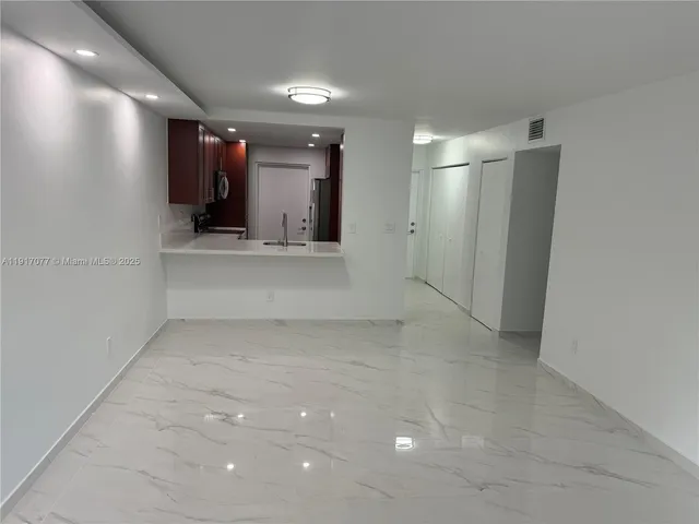 an empty room with a mirror