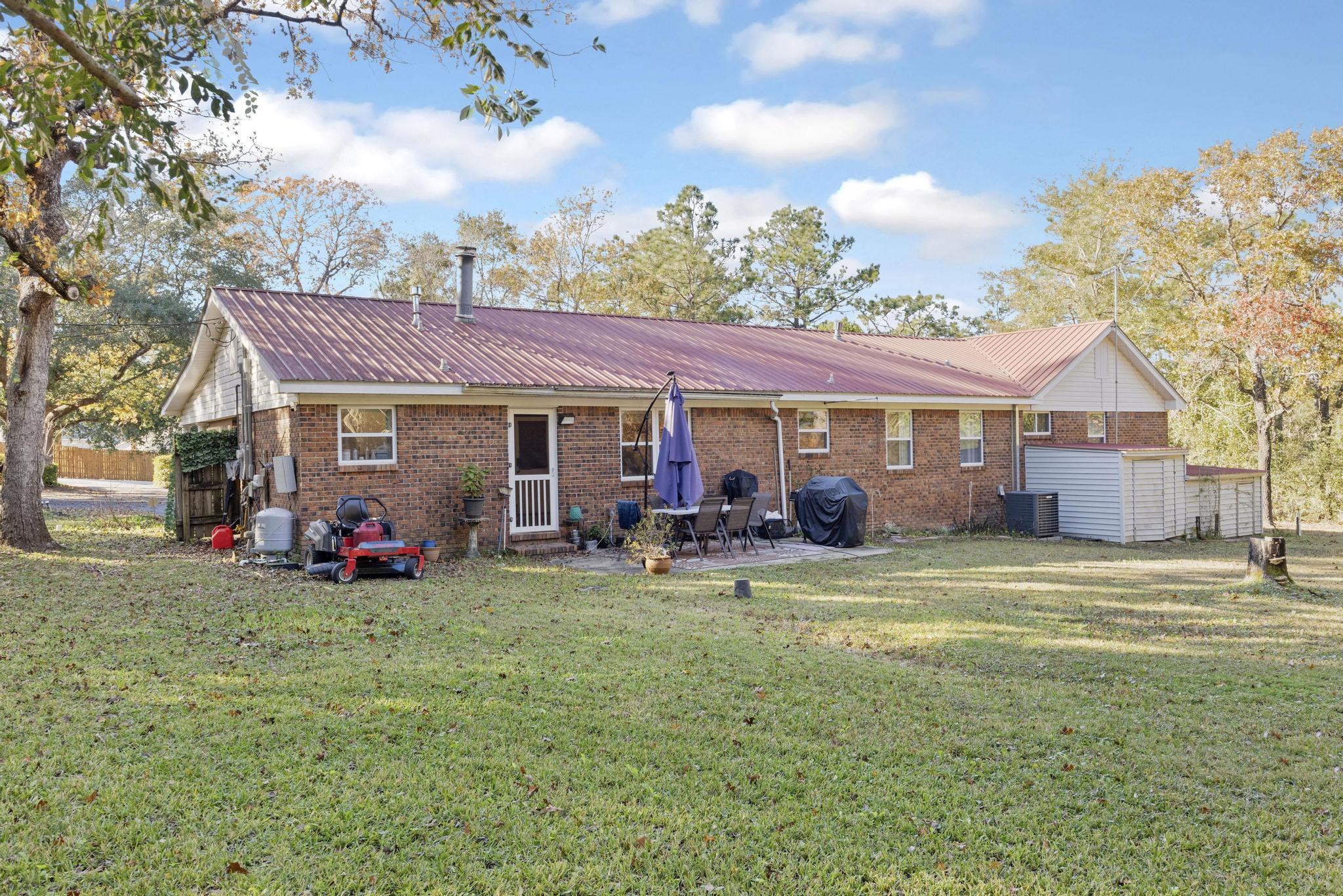 14 Pandora Drive Crestview, FL 32536 - Photo 31 of 40 a view of a house with table and chairs in patio