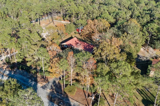a aerial view of a house with a yard
