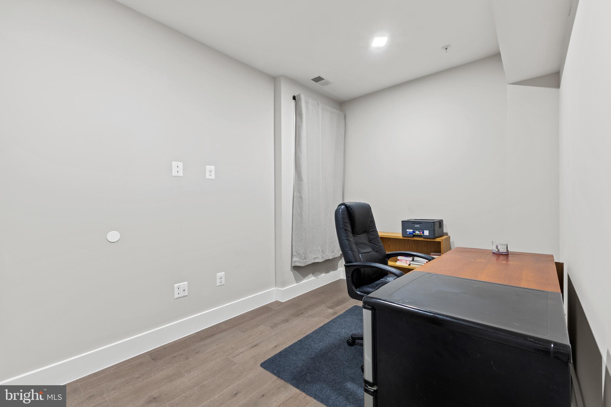 1028 Bladensburg Road Northeast, Unit 37 Washington, DC 20002 - Photo 18 of 29 a workspace with furniture and lamp