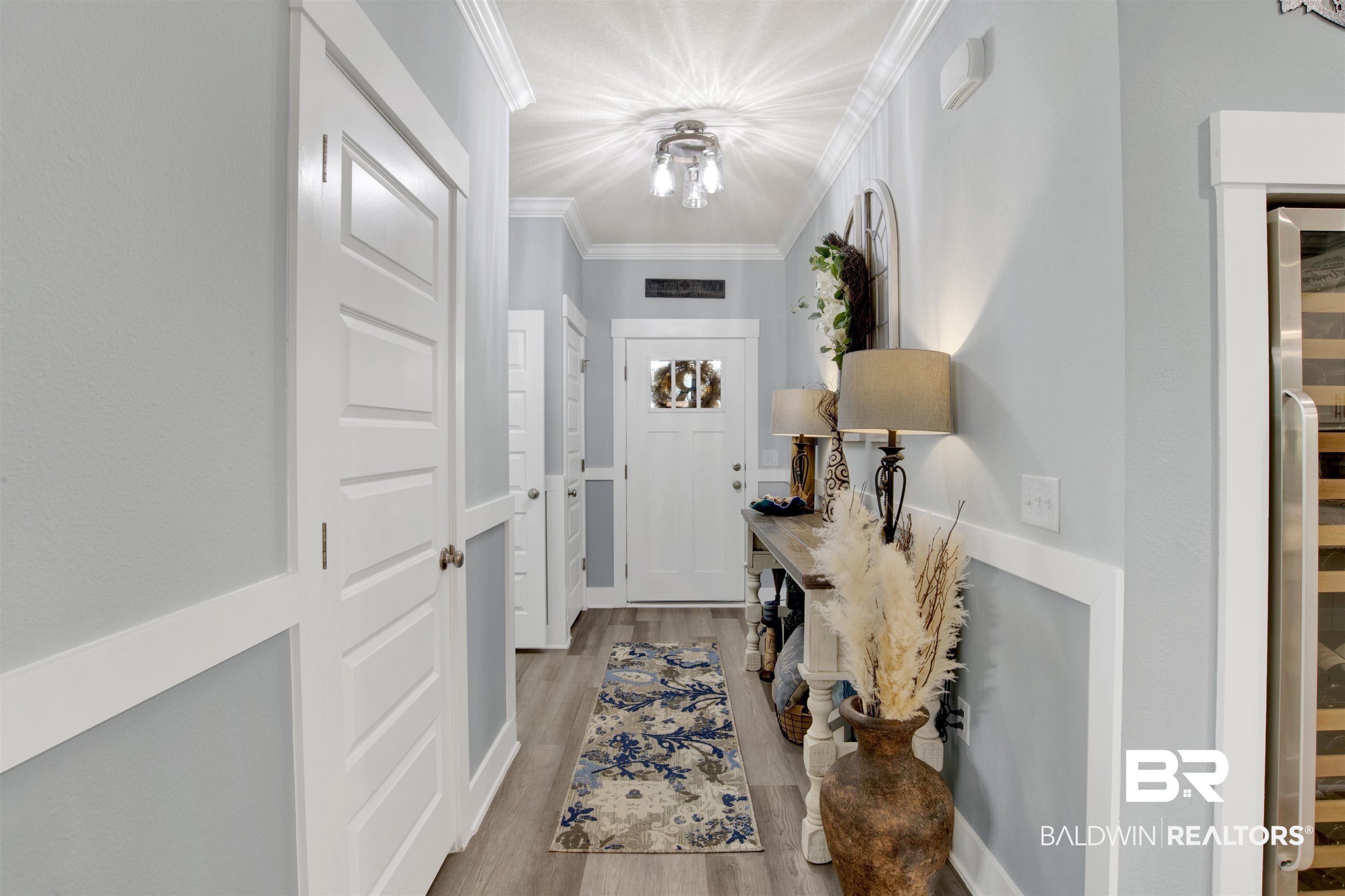 10113 Lakeview Drive Foley, AL 36535 - Photo 5 of 34 Entryway featuring light hardwood / wood-style flooring and ornamental molding
