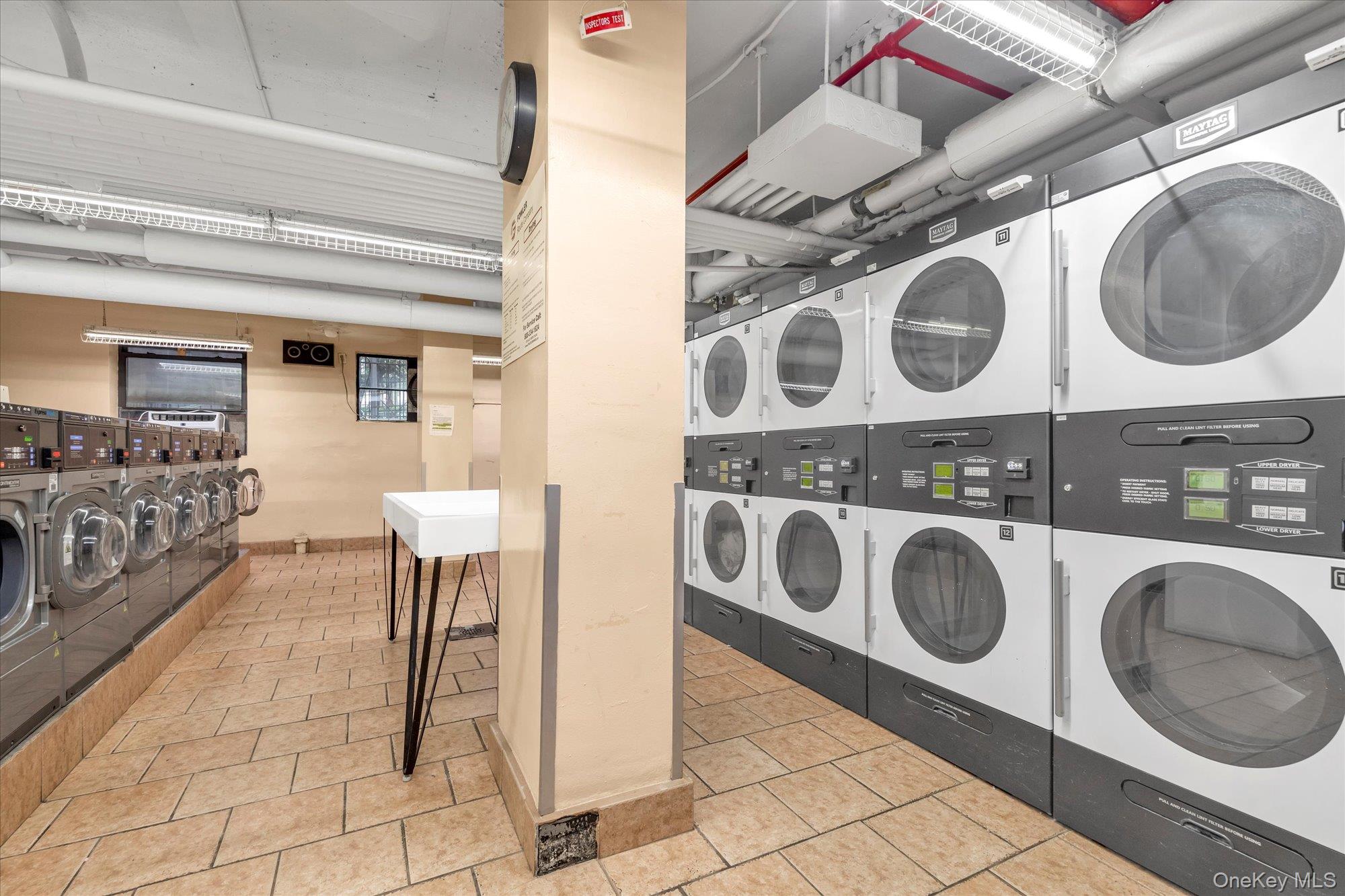 61-15 97th Street, Unit 12A Queens, NY 11374 - Photo 19 of 25 a utility room with sink dryer and washer