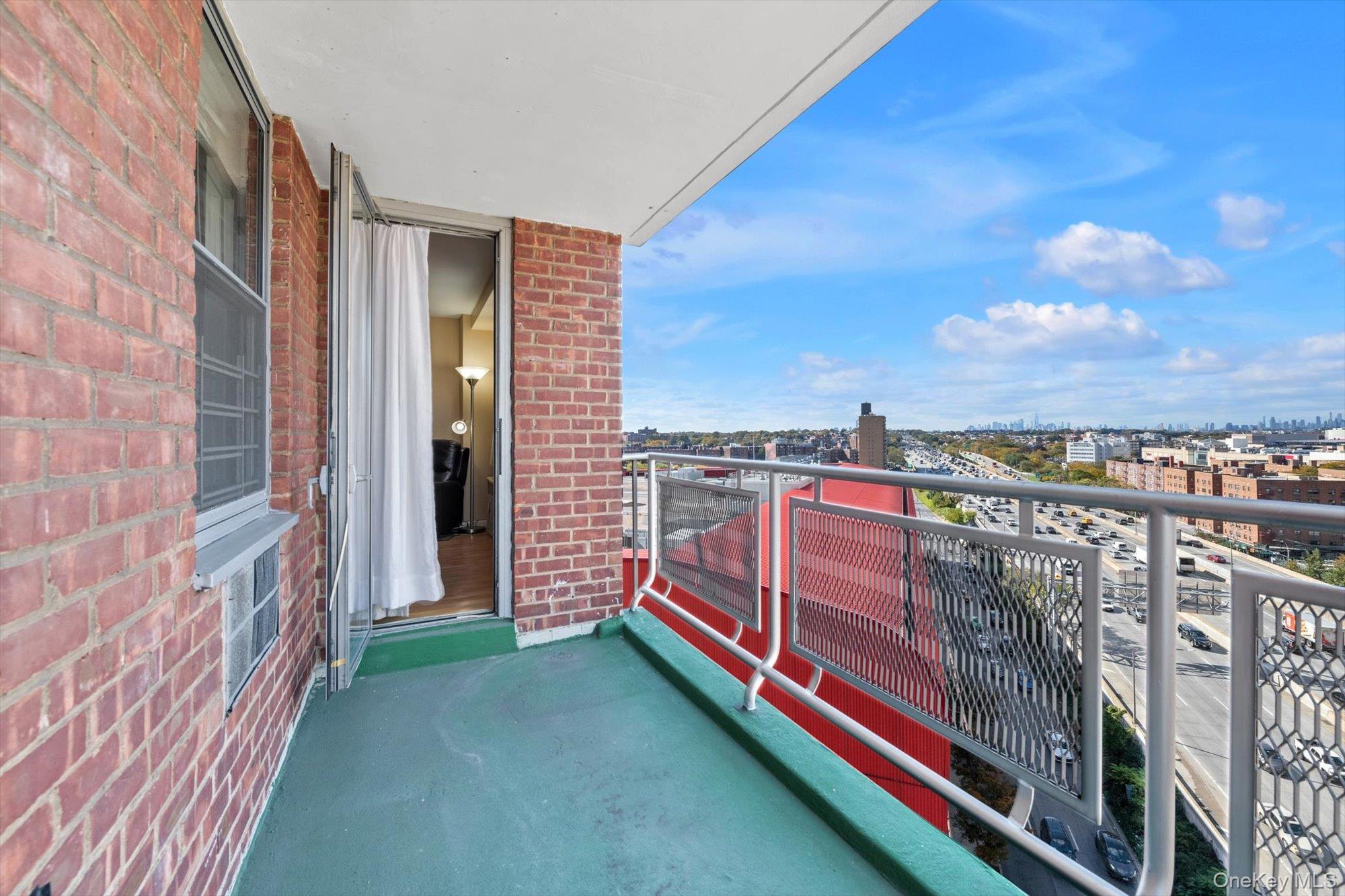 61-15 97th Street, Unit 12A Queens, NY 11374 - Photo 10 of 25 a balcony with city view