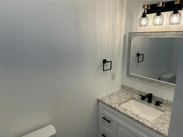 a bathroom with a sink and a toilet