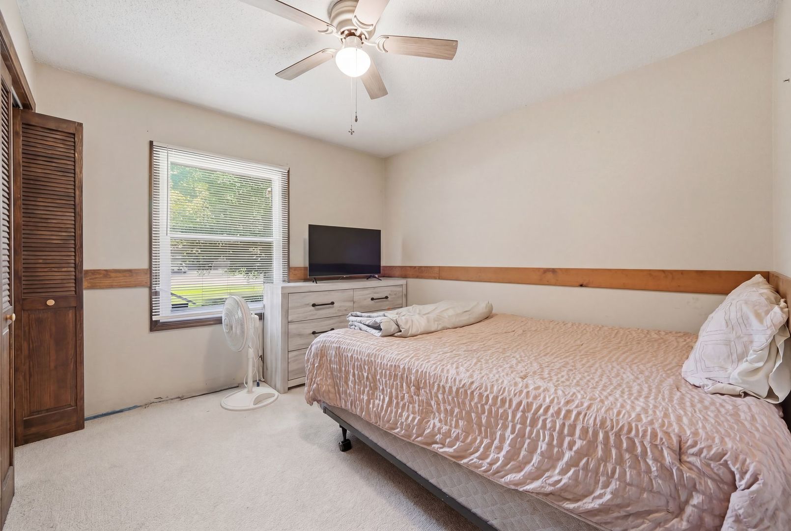 5645 Beebe Drive Rochelle, IL 61068 - Photo 18 of 43 a bedroom with a bed and a flat screen tv