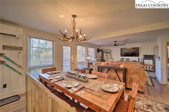 a view of a dining room with furniture window and wooden floor