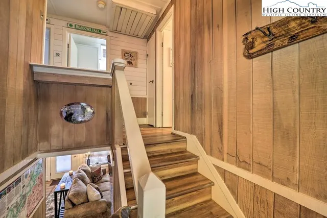 a view of a entryway with wooden floor and door